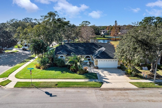 view of front facade featuring a garage and a front lawn