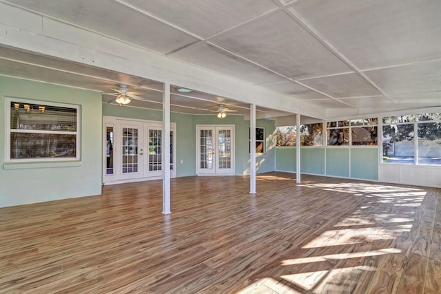 unfurnished sunroom featuring french doors and plenty of natural light