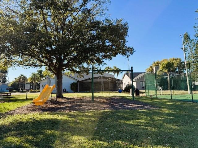 view of jungle gym with a lawn