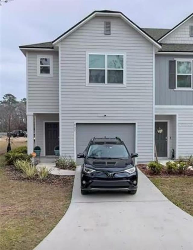 view of front facade with a front lawn and a garage