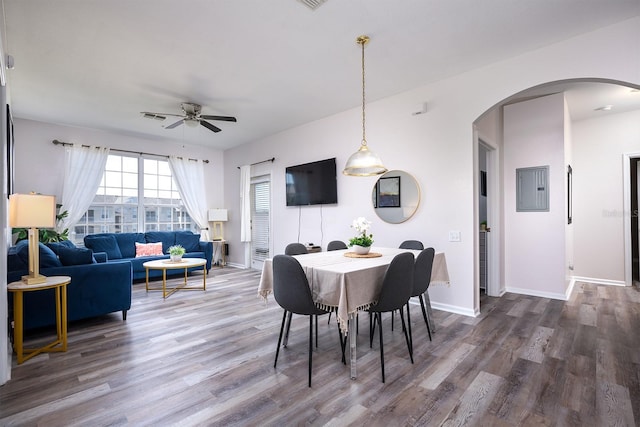 dining area featuring electric panel, ceiling fan, and hardwood / wood-style floors