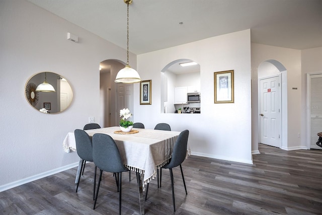 dining space featuring dark hardwood / wood-style floors