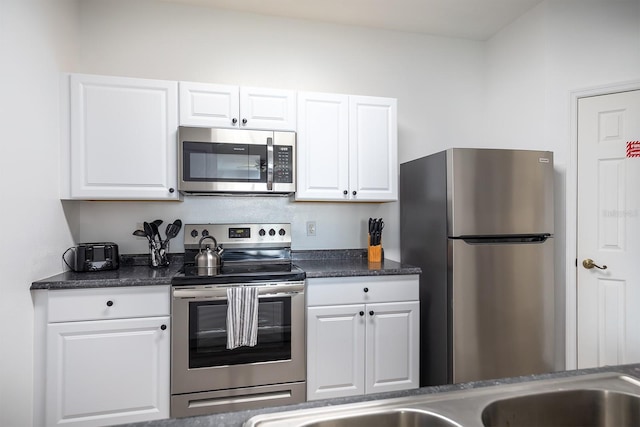 kitchen featuring white cabinetry and appliances with stainless steel finishes