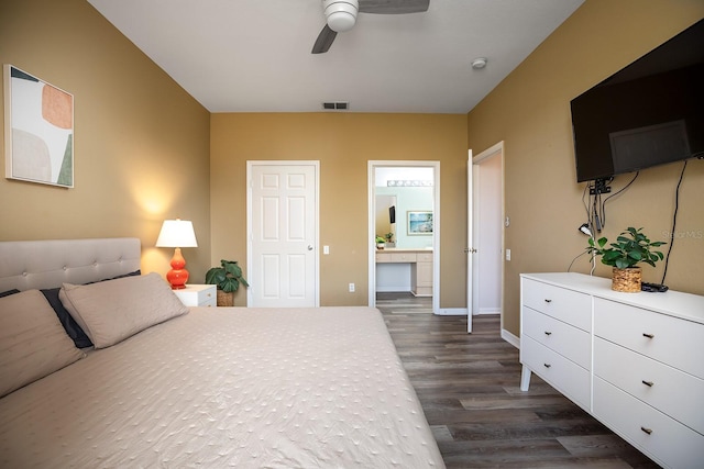 bedroom with connected bathroom, ceiling fan, and dark hardwood / wood-style floors