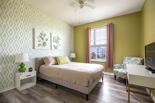 bedroom featuring hardwood / wood-style floors and ceiling fan