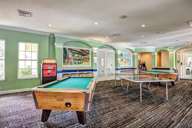 playroom with a textured ceiling, crown molding, and pool table