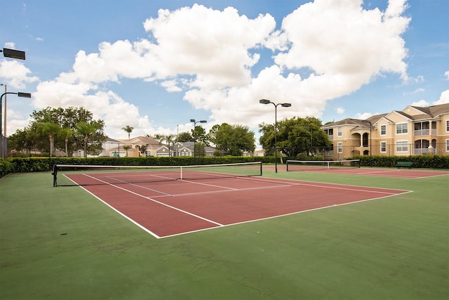 view of sport court featuring basketball hoop