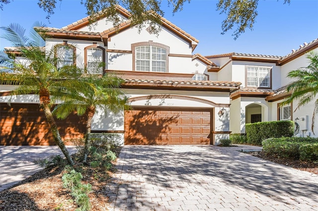 mediterranean / spanish-style house featuring a garage