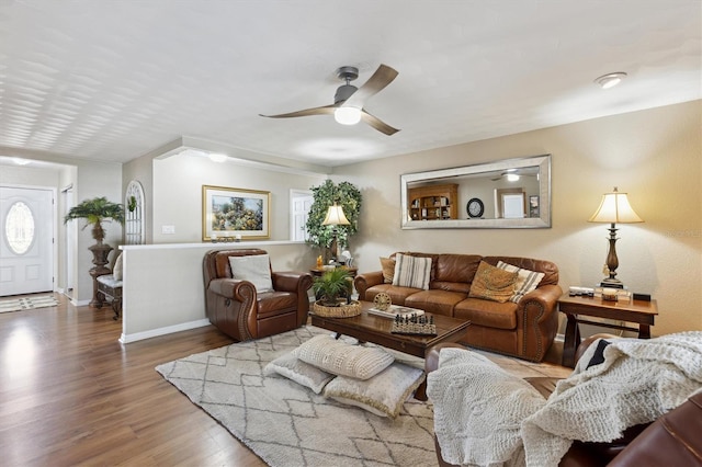 living room featuring hardwood / wood-style flooring and ceiling fan