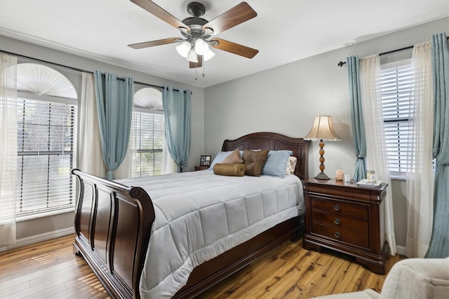 bedroom featuring ceiling fan and light hardwood / wood-style floors