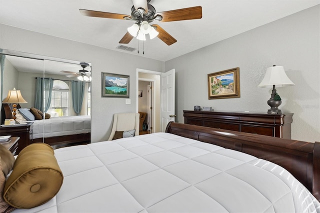 bedroom with ceiling fan and a closet