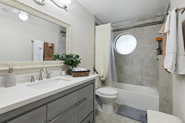 full bathroom with vanity, tile patterned floors, toilet, a textured ceiling, and shower / tub combo with curtain