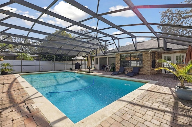 view of pool featuring a lanai and a patio