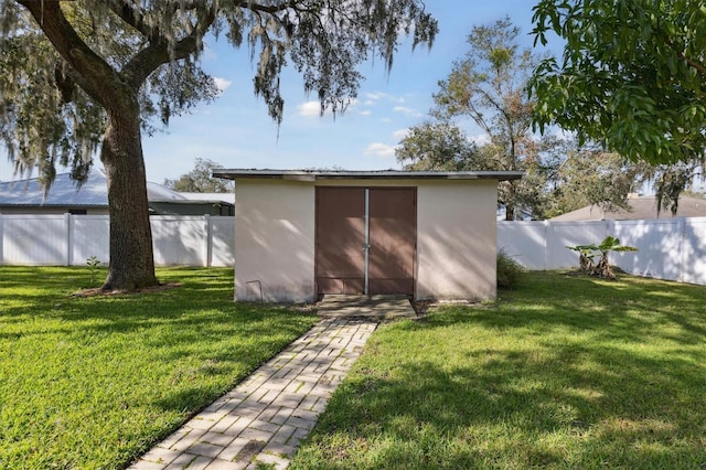 view of outdoor structure with a yard