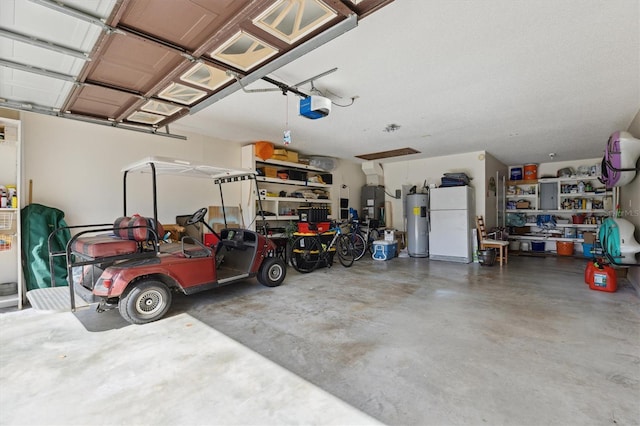 garage with white refrigerator, electric water heater, and a garage door opener