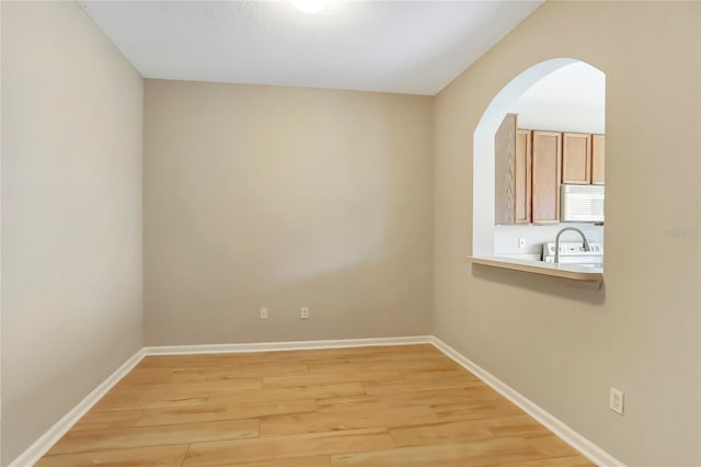 spare room with light wood-type flooring