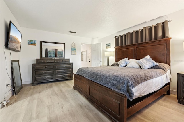 bedroom featuring light wood-type flooring