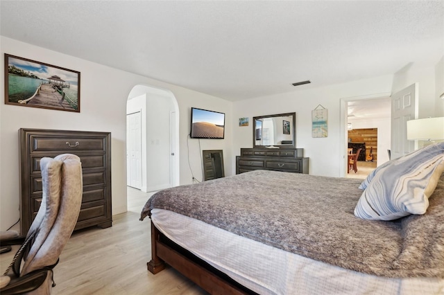 bedroom featuring light hardwood / wood-style floors and a closet