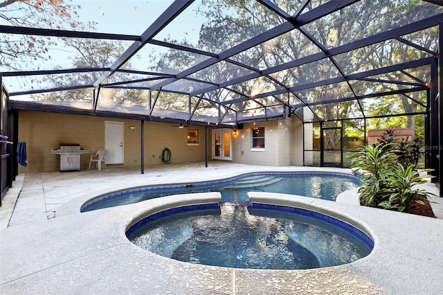 view of pool featuring glass enclosure, an in ground hot tub, a patio area, and grilling area