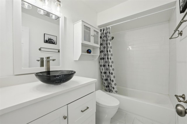 full bathroom with shower / bath combo, toilet, and vanity