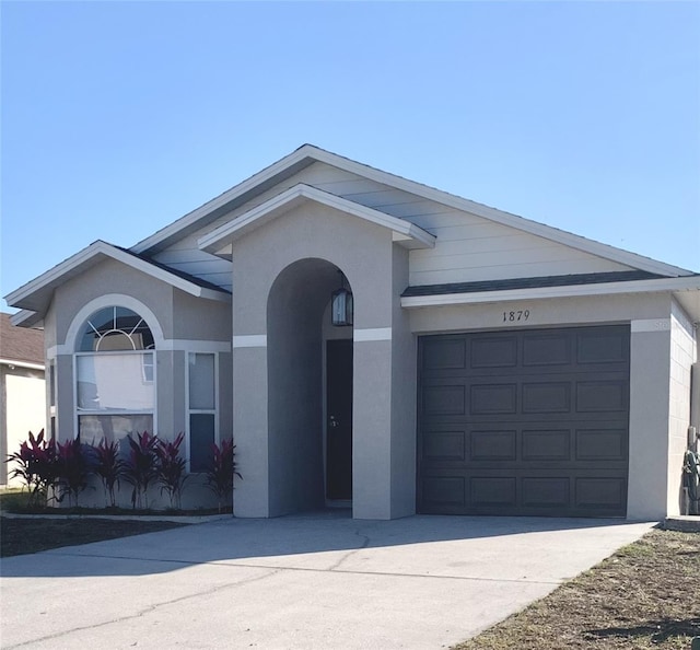 ranch-style house featuring a garage