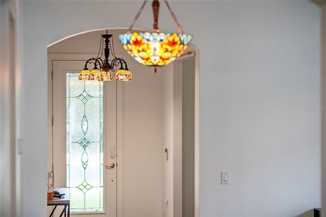 foyer with an inviting chandelier