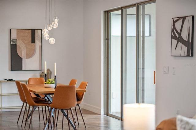 dining area with hardwood / wood-style floors