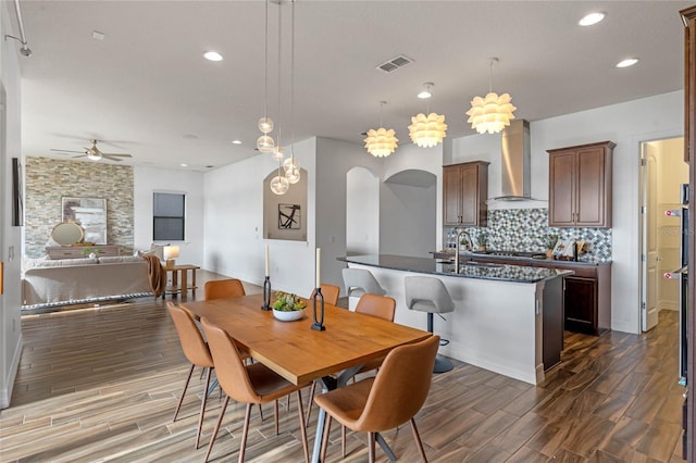 dining area with sink and ceiling fan