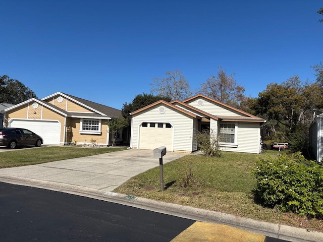 single story home featuring a front lawn and a garage