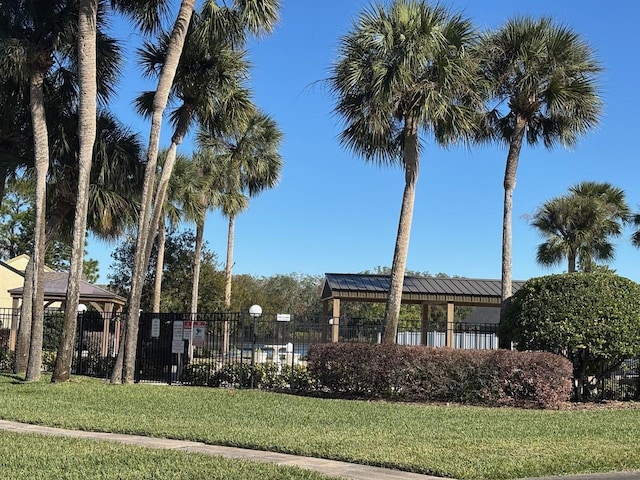 view of property's community featuring a gazebo and a lawn