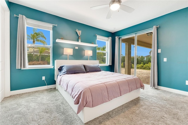 carpeted bedroom with access to outside and ceiling fan