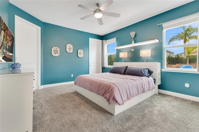 carpeted bedroom featuring ceiling fan