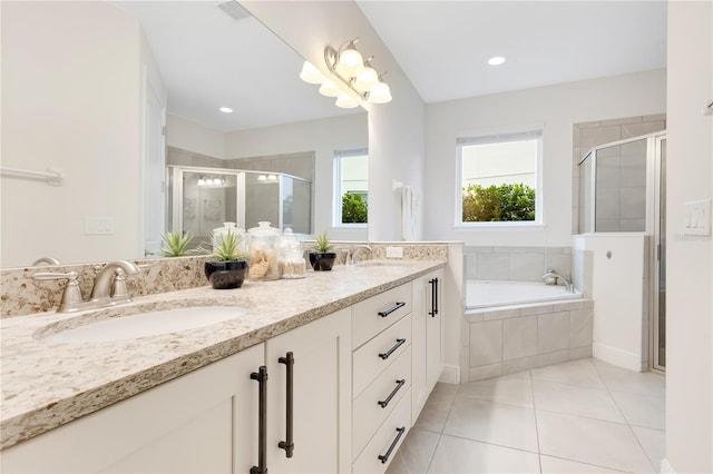 bathroom featuring separate shower and tub, vanity, and tile patterned floors