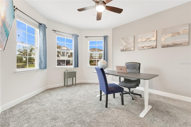 home office featuring ceiling fan and carpet