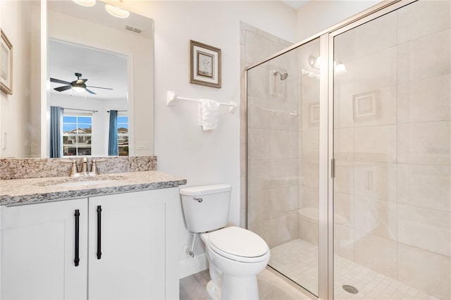 bathroom featuring ceiling fan, toilet, walk in shower, and vanity