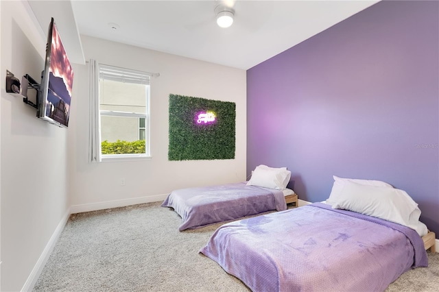 bedroom with ceiling fan and carpet