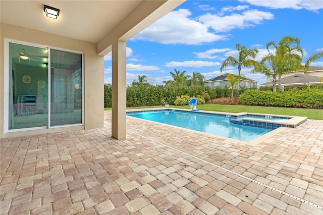 view of swimming pool featuring an in ground hot tub and a patio area