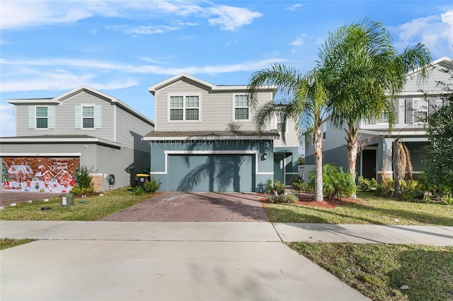 view of front facade with a garage and a front yard