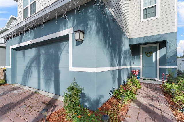 property entrance with a garage