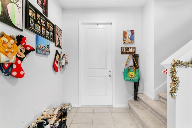 mudroom featuring light tile patterned floors