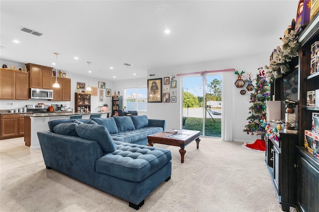 carpeted living room with sink