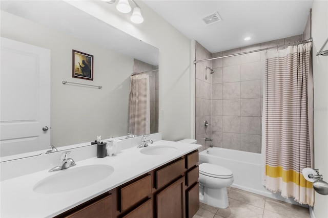 full bathroom featuring tile patterned flooring, vanity, toilet, and shower / tub combo with curtain