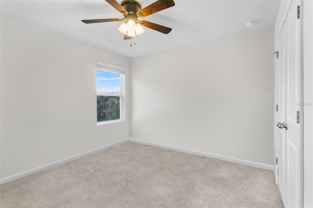 carpeted empty room with ceiling fan