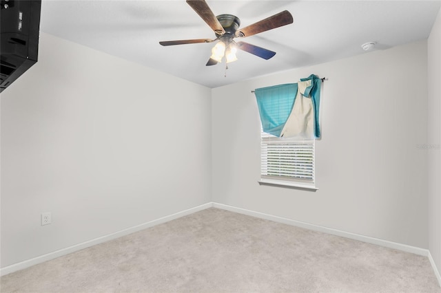 empty room with light carpet and ceiling fan