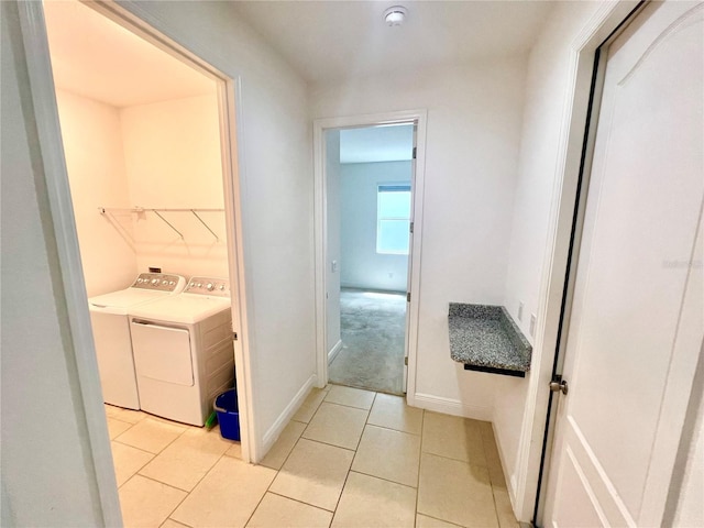 3333 Wauseon Dr, Saint Cloud, FL 34772 - washroom with washer and dryer, light tile patterned floors, and baseboards