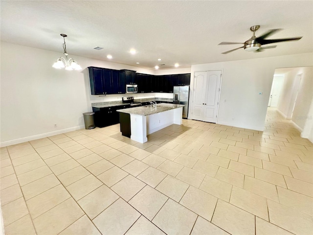 3333 Wauseon Dr, Saint Cloud, FL 34772 - kitchen featuring open floor plan, stainless steel appliances, a sink, light tile patterned floors, and recessed lighting