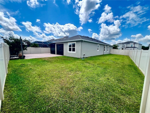 3333 Wauseon Dr, Saint Cloud, FL 34772 - back of house with a patio area, stucco siding, and solar panels