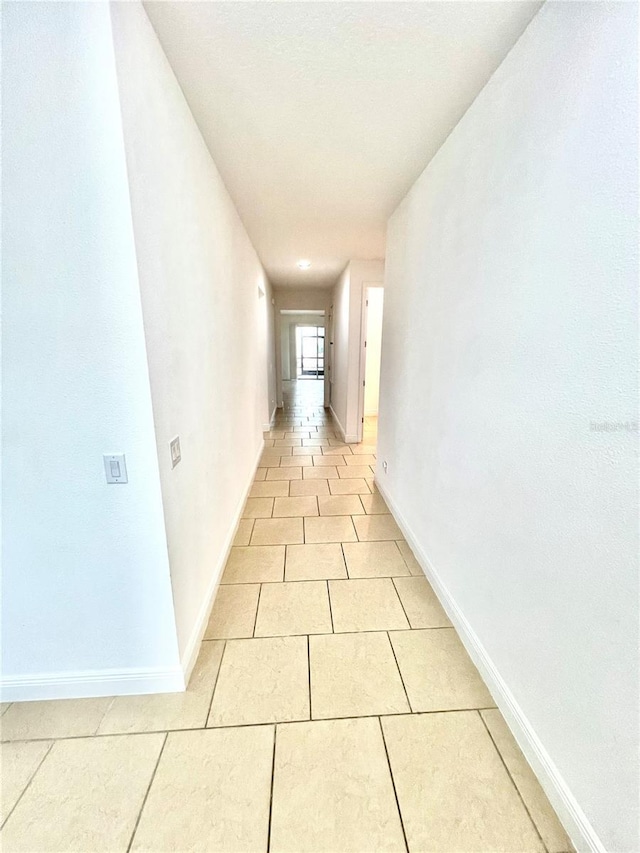 3333 Wauseon Dr, Saint Cloud, FL 34772 - corridor featuring light tile patterned flooring and baseboards