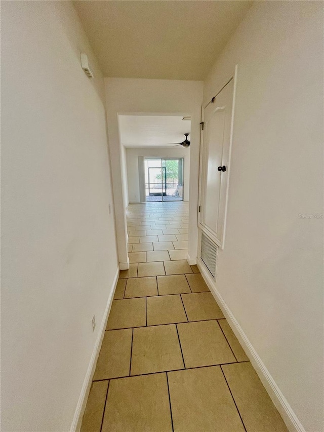 3333 Wauseon Dr, Saint Cloud, FL 34772 - corridor with tile patterned floors and baseboards