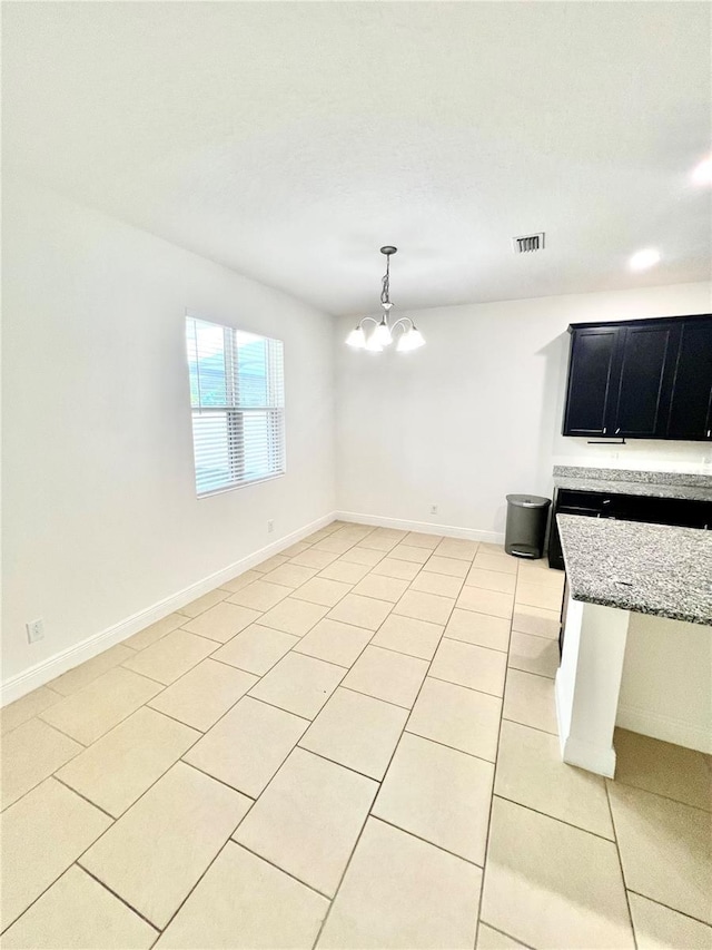 3333 Wauseon Dr, Saint Cloud, FL 34772 - unfurnished dining area featuring light tile patterned flooring, a chandelier, and baseboards